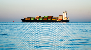 A shipping vessel in the water with sound waves illustrated on the water surface