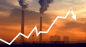 Upward line graph with smokestack image in background