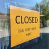 Sign on storefront in Ashcroft BC with text "Closed due to extreme heat"